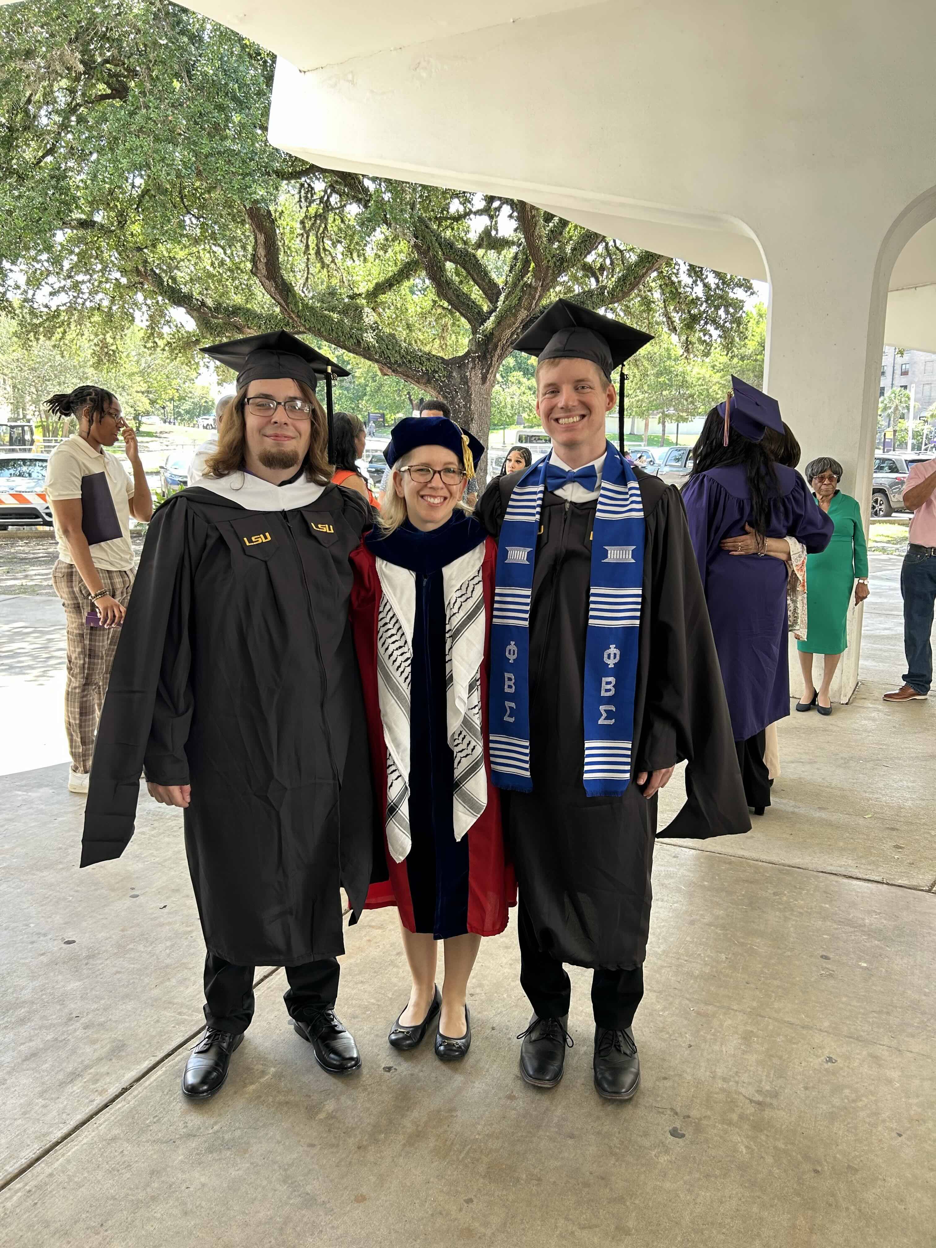 faculty and graduating MA students